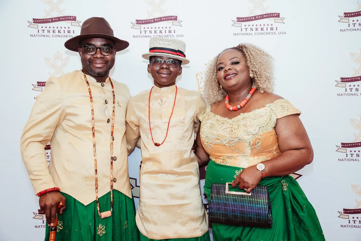 A father, mother and son in matching wrappers and coral beads, Convention 2026, San Francisco