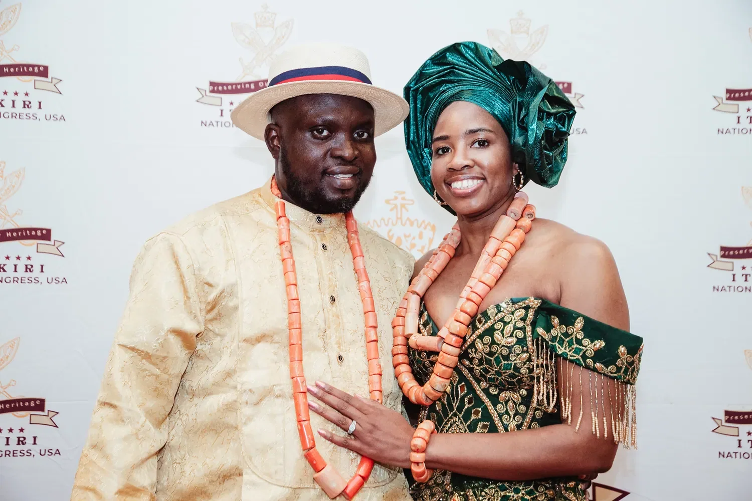 A couple in coral beads and green gele on the red carpet, Convention 2026, San Francisco