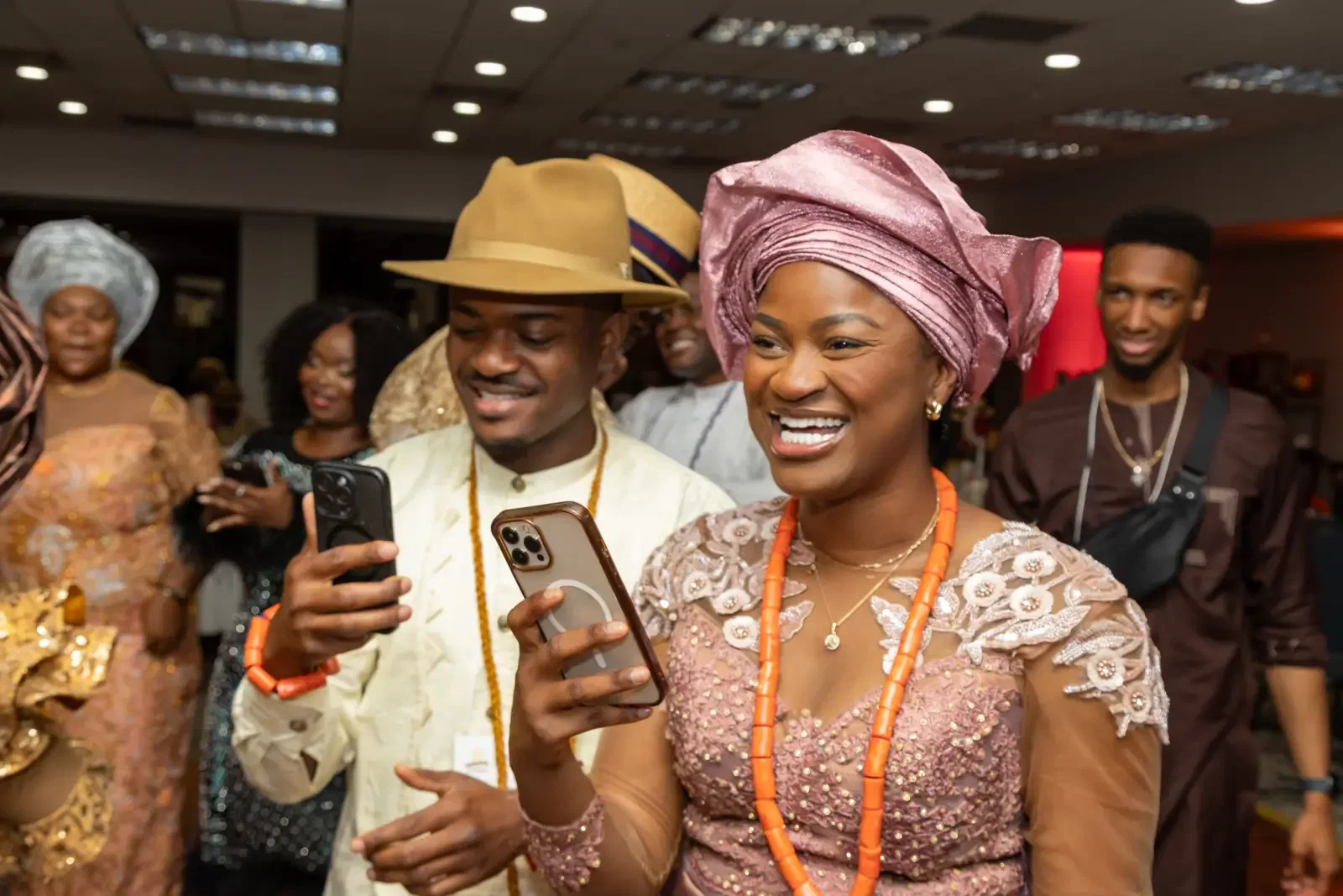 A couple smiling in coral beads at the Gala, Convention 2025, Miami