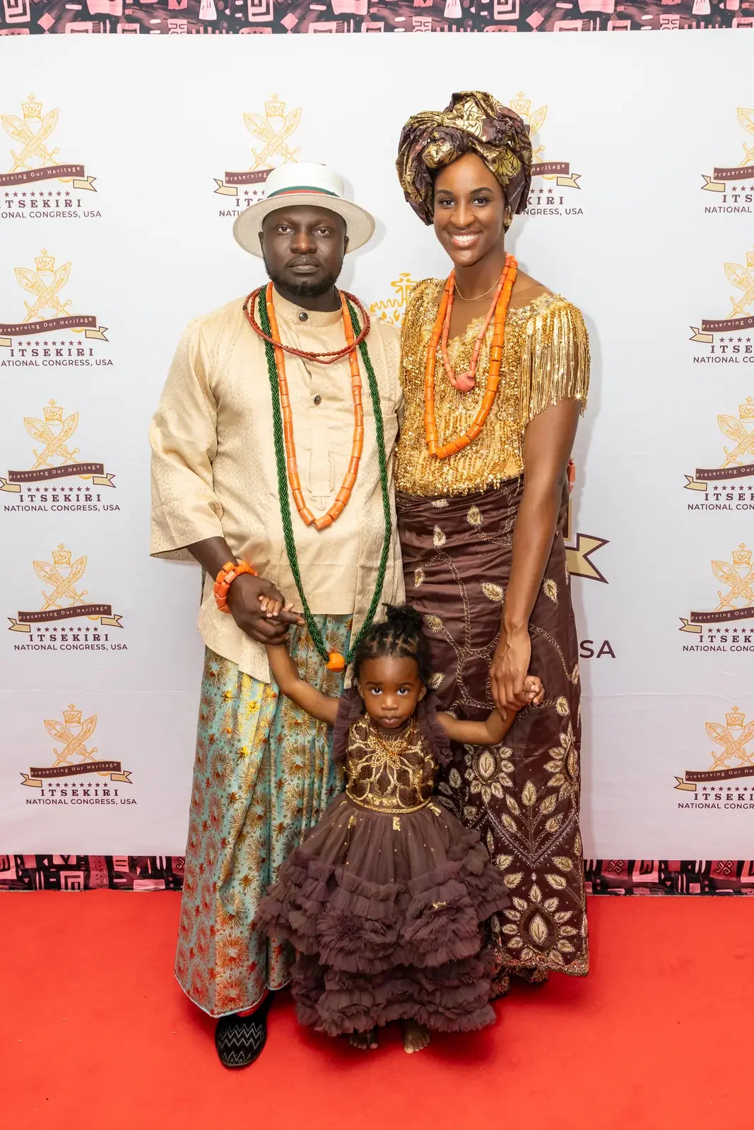 A family with a small child in matching attire on the red carpet, Convention 2025, Miami
